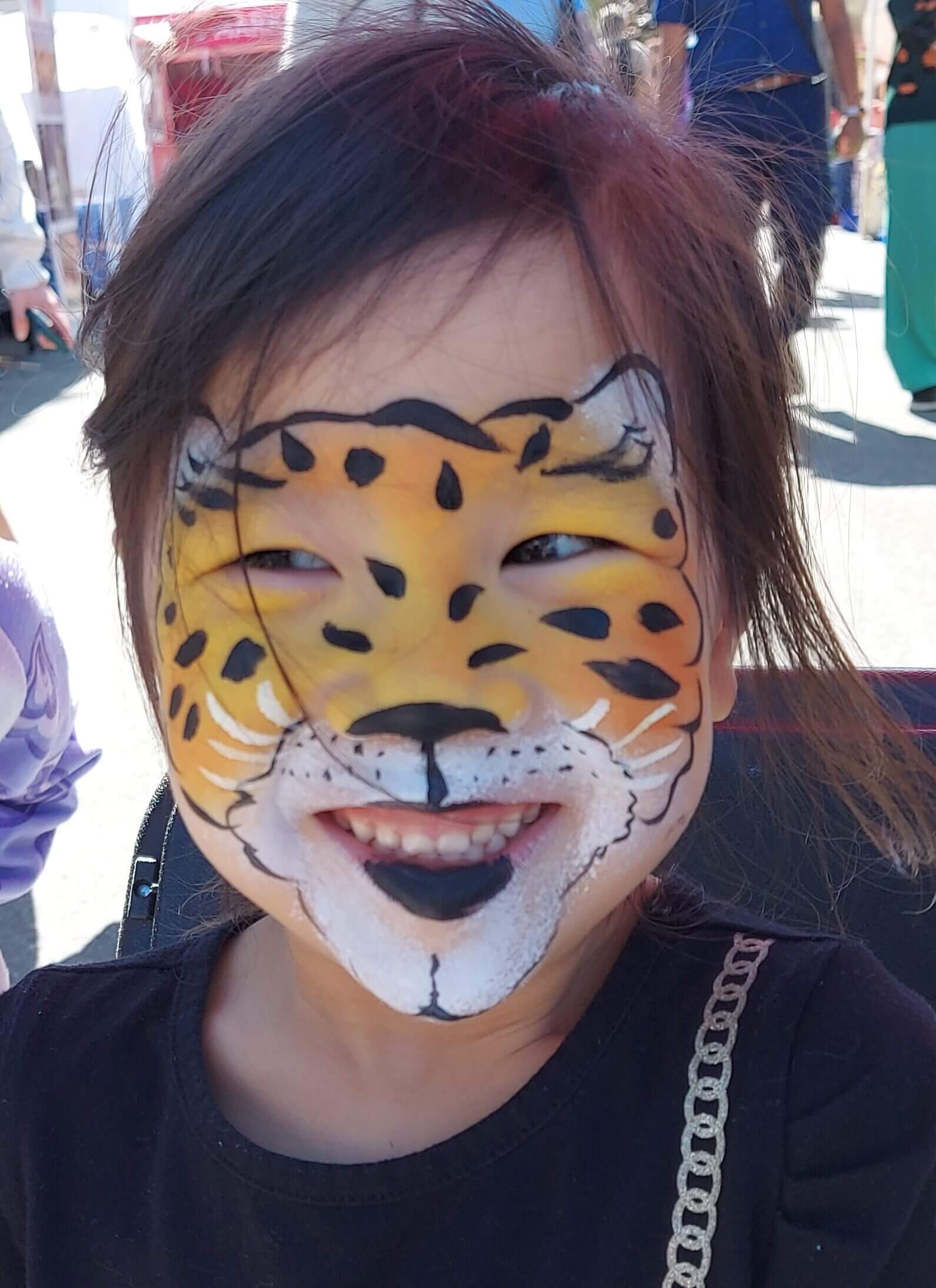 Cheetah face painting at a Vancouver Farmer's market