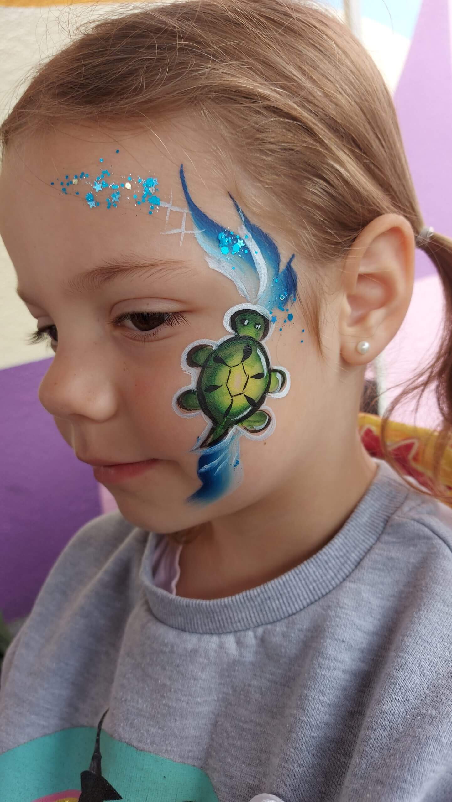 Turtle face painting at a Vancouver block party