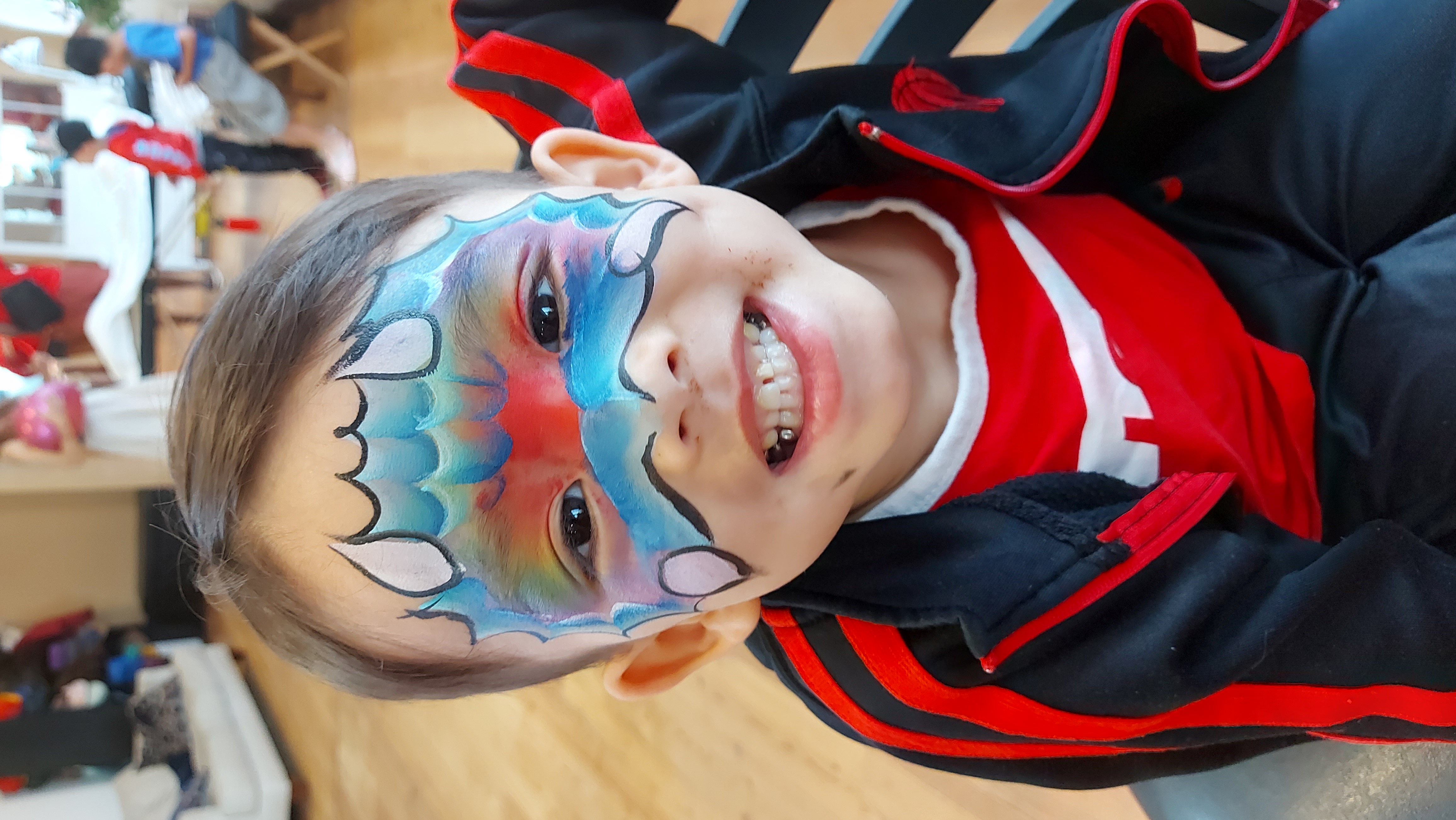 Dinosaur face painting at a Vancouver rave