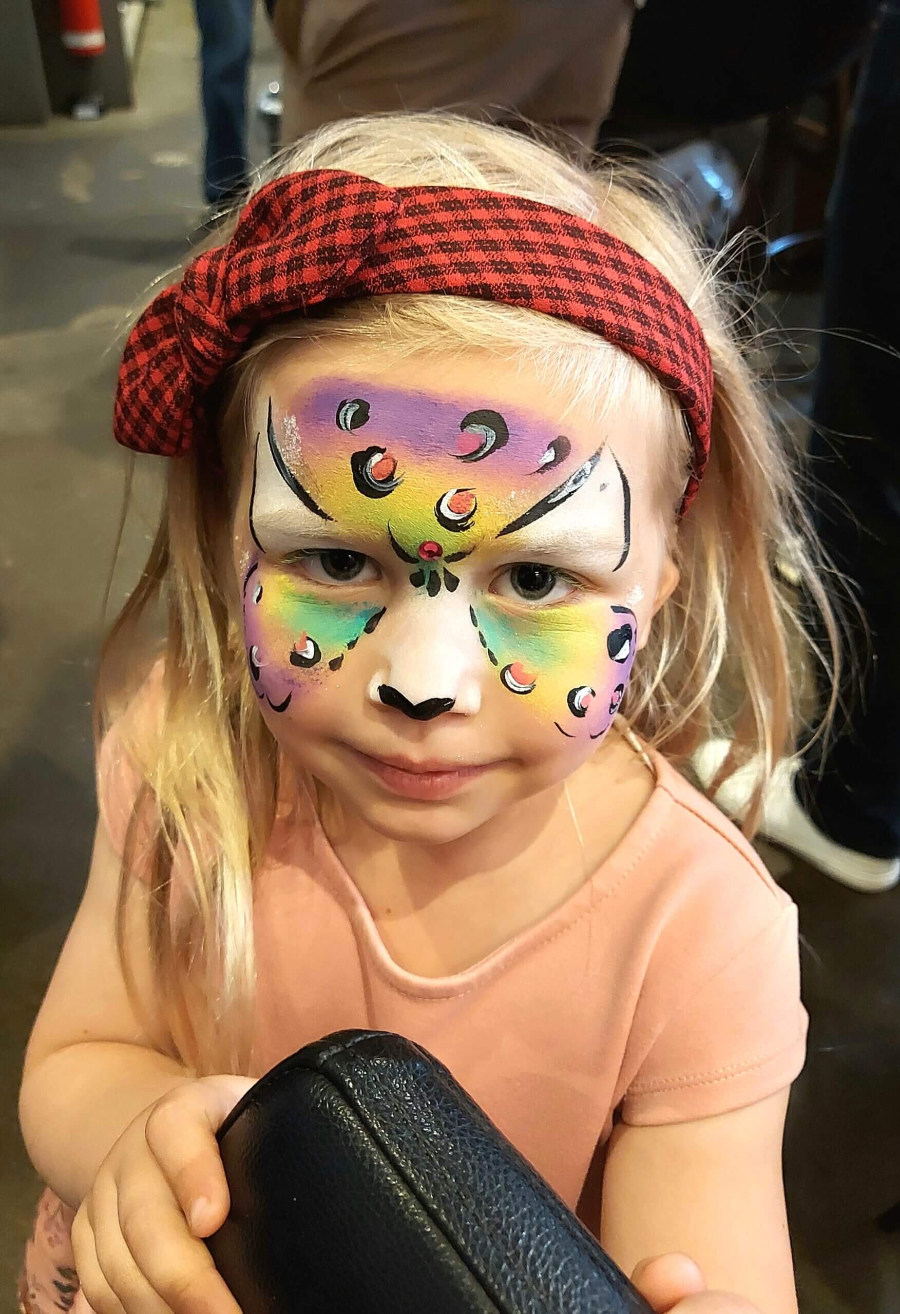 Rainbow animal face painting at a Vancouver baby reveal party