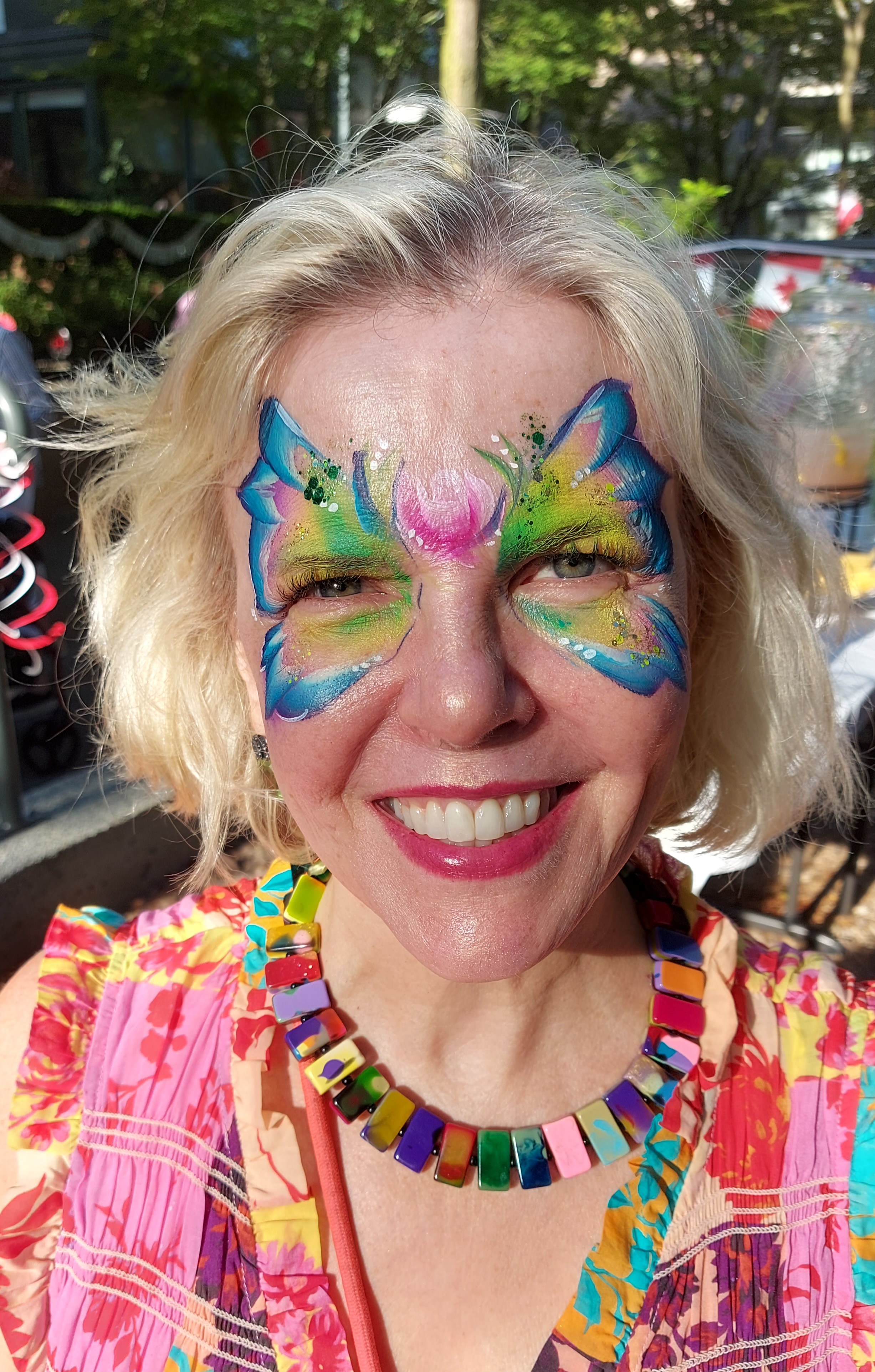 Butterly with rose face painting at a Vancouver block party