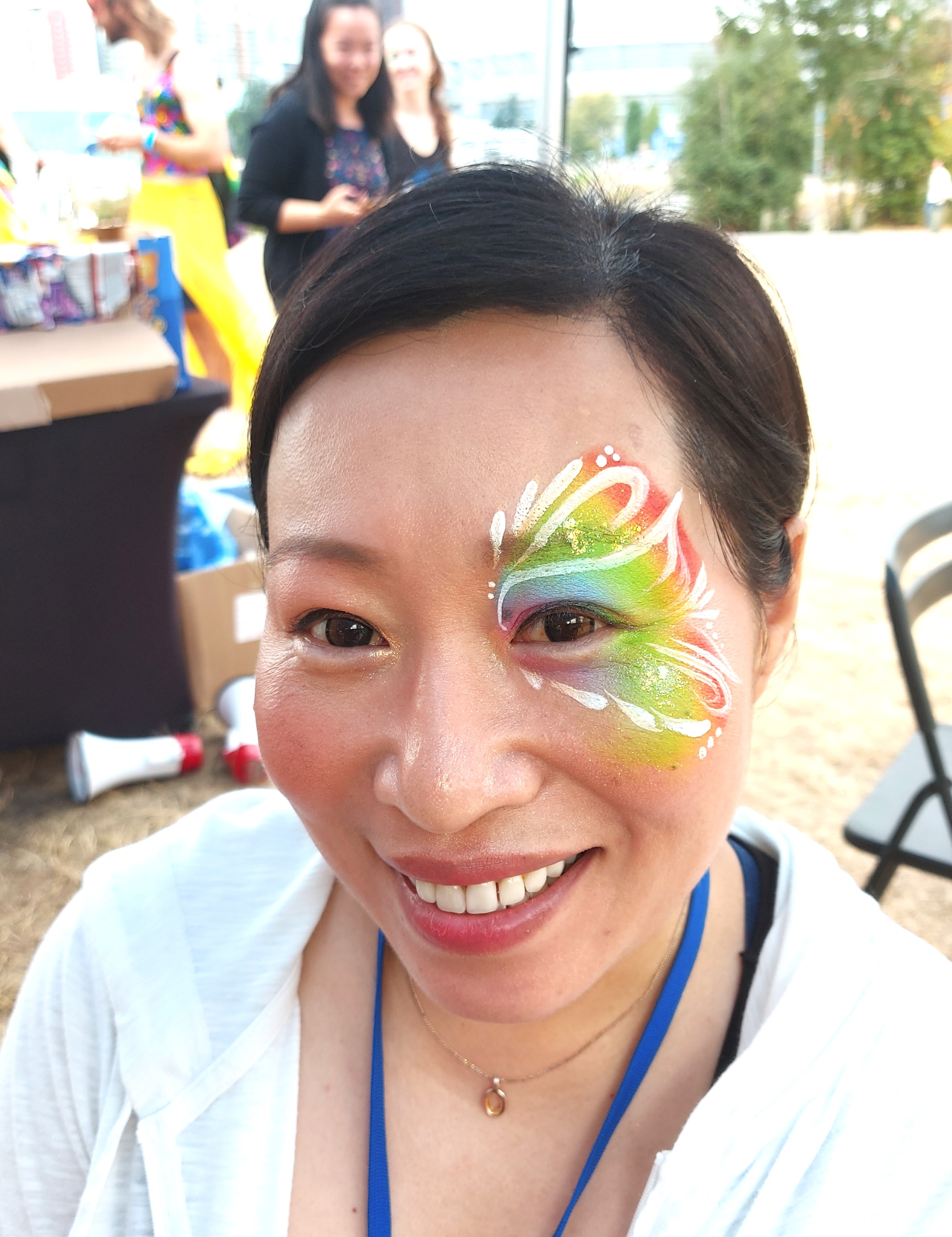 Rainbow face painting at a Vancouver event