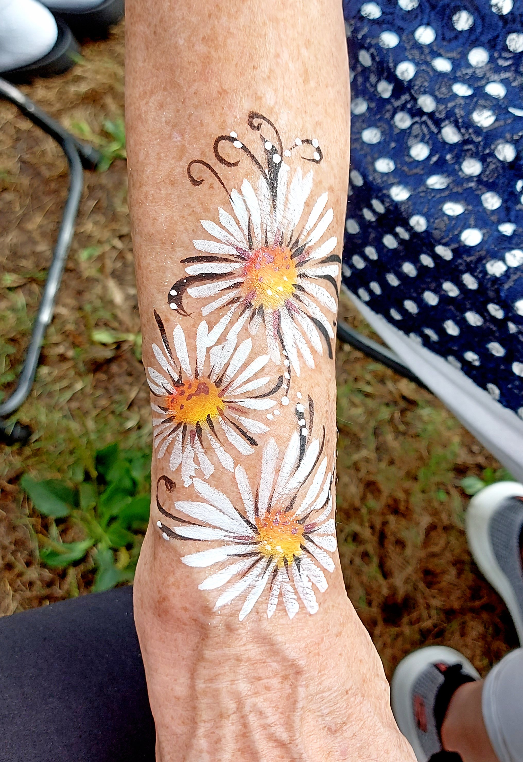 Daisies arm painting at a Vancouver charity event