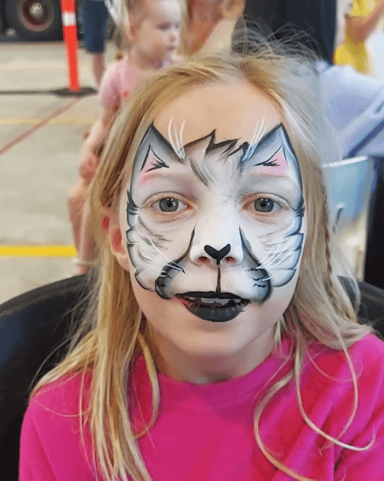 Cat face painting at a Vancouver fire station open day